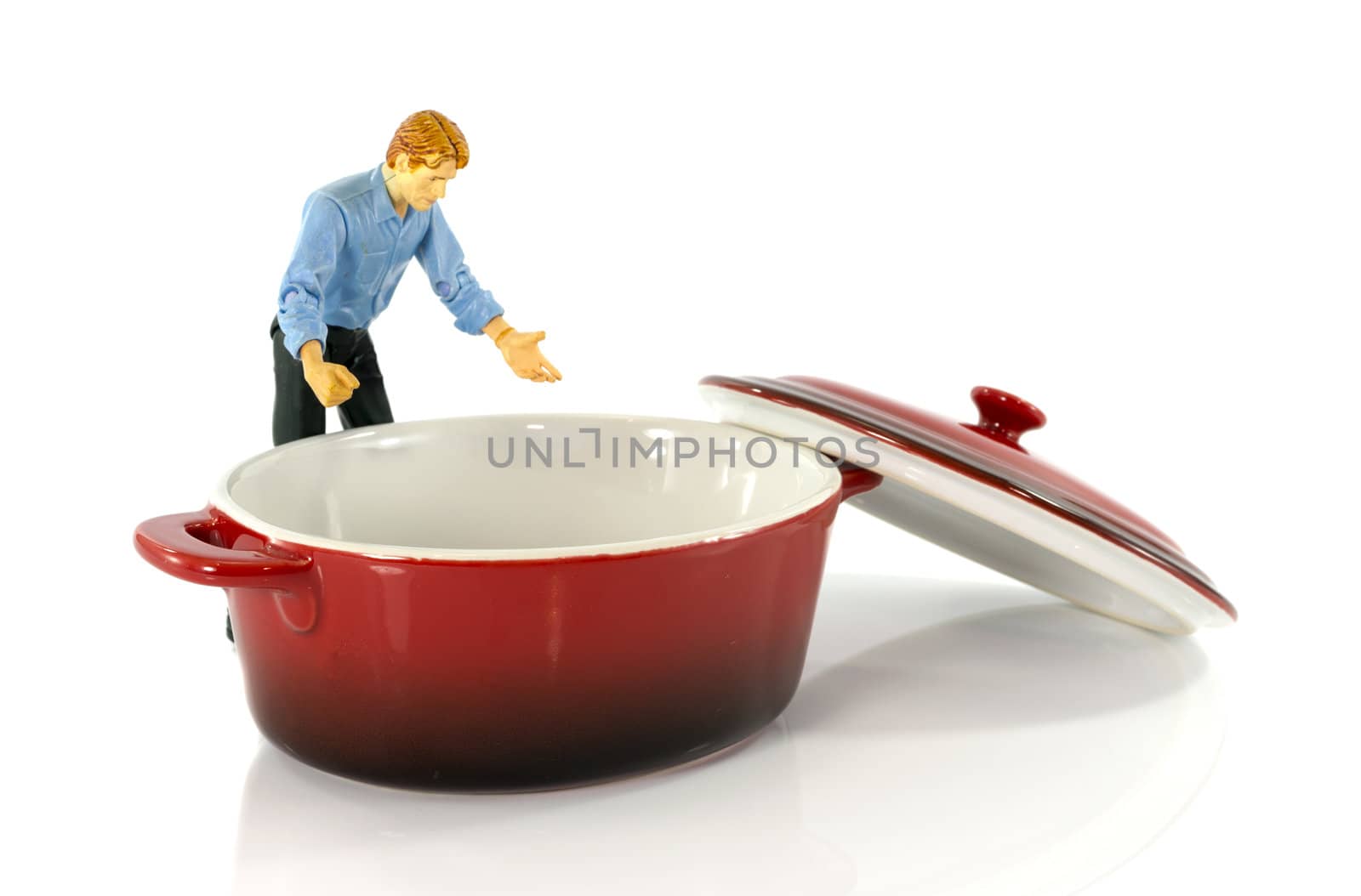 model man looking in red empty saucepan