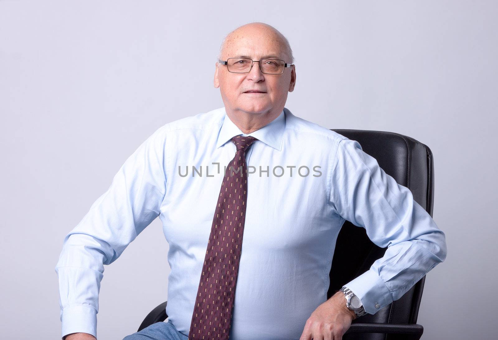 portrait of a successful senior man by Discovod
