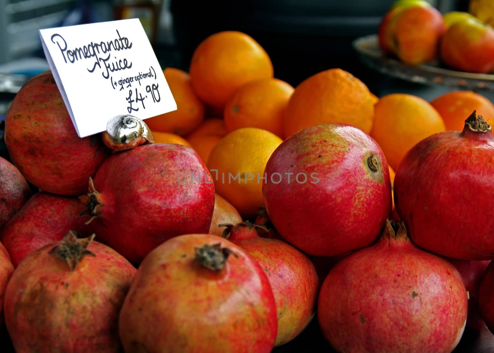 Pomegranate and other types of fruit presented at market