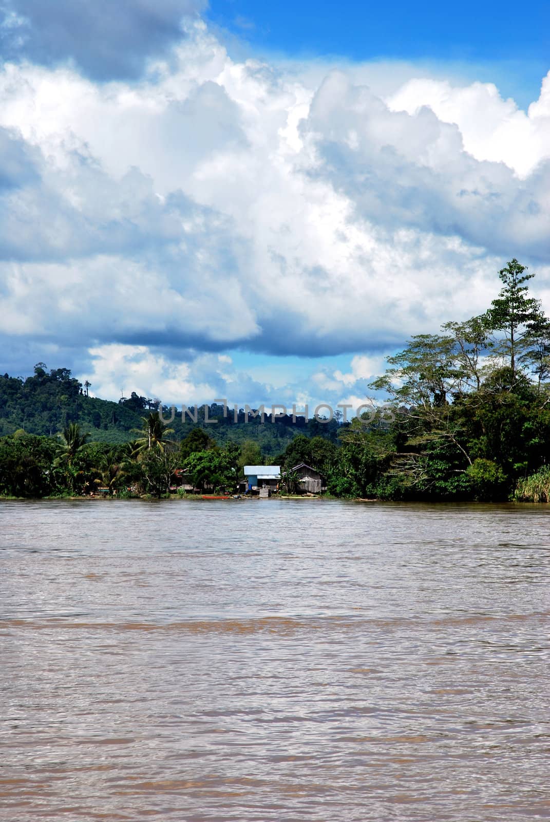 view of a village on the banks of the river Malinau, Indonesia