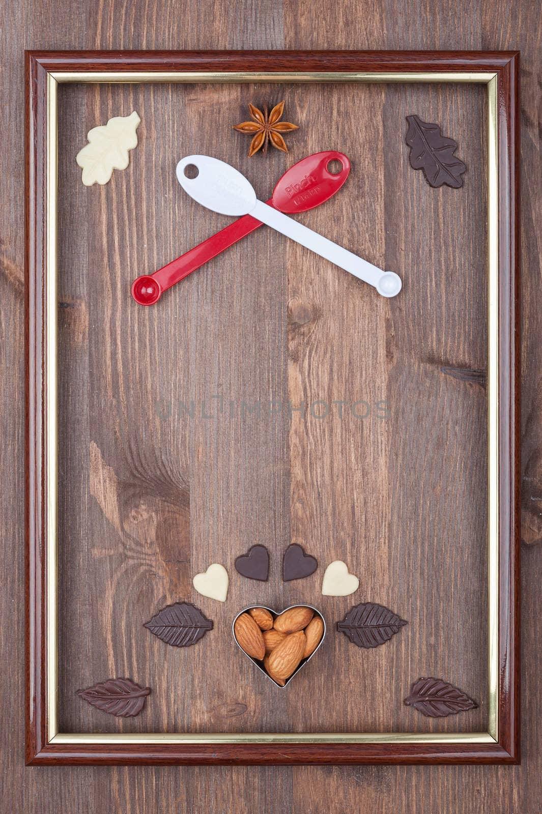 Culinary frame as the coat of arms on a wooden background