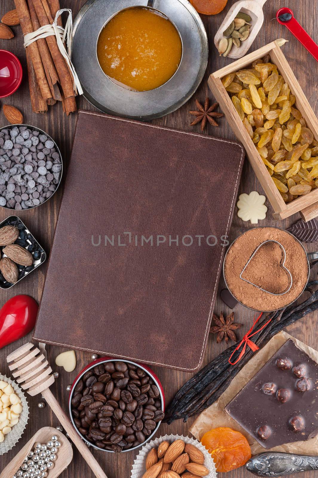 Cover of the book to write prescriptions surrounded ingredients for a sweet holiday baking