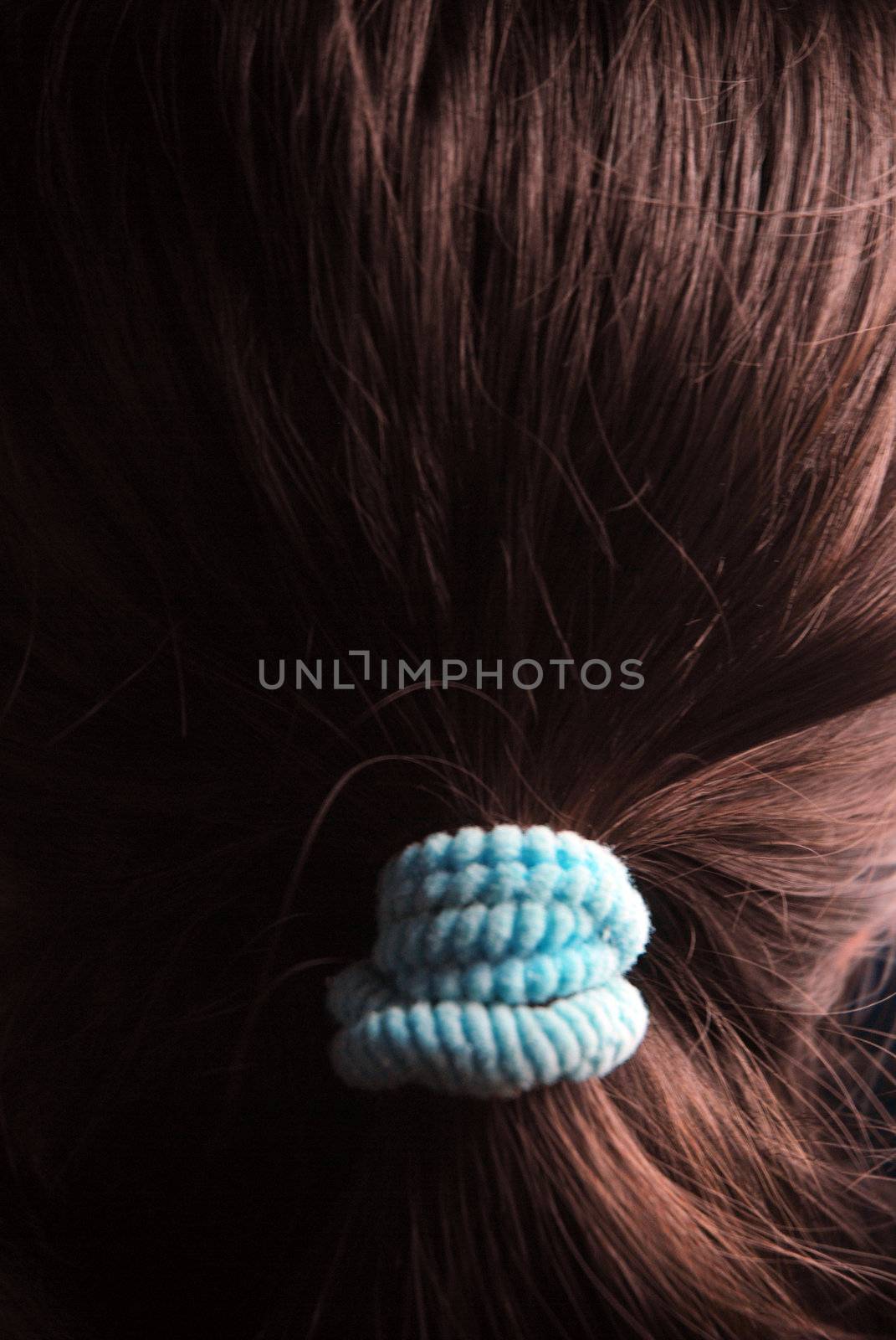 details a woman's hair is brown with a blue binder