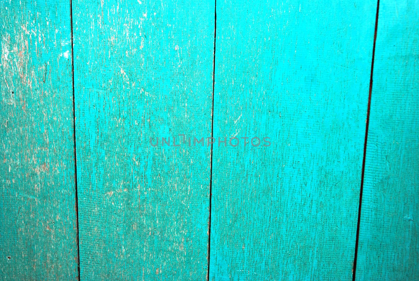 detailed of  texture and pattern at old wooden boards with paint that was peeling and faded