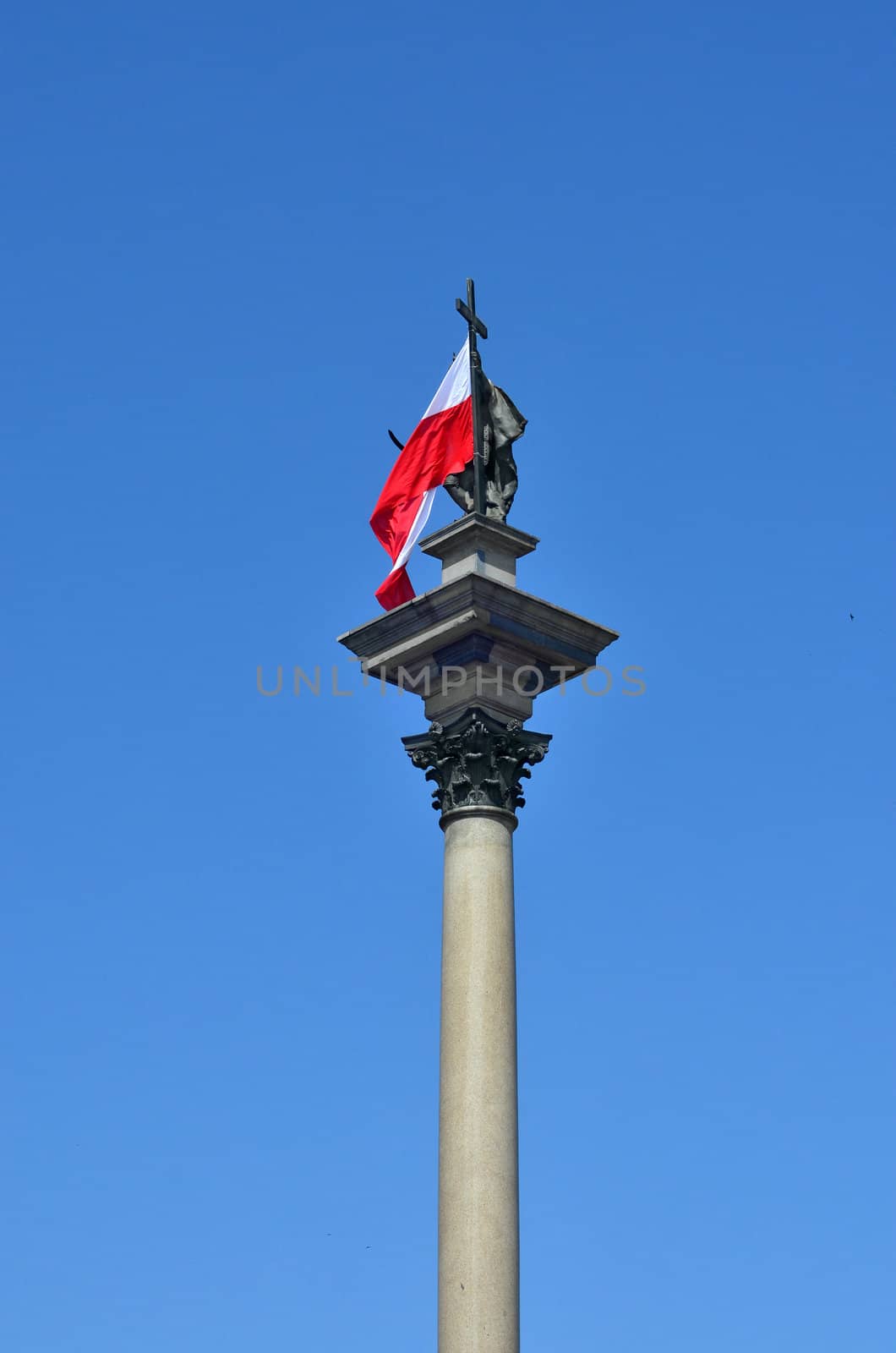 Constitution Day in Poland. King monument in Warsaw is decorated with polish flag