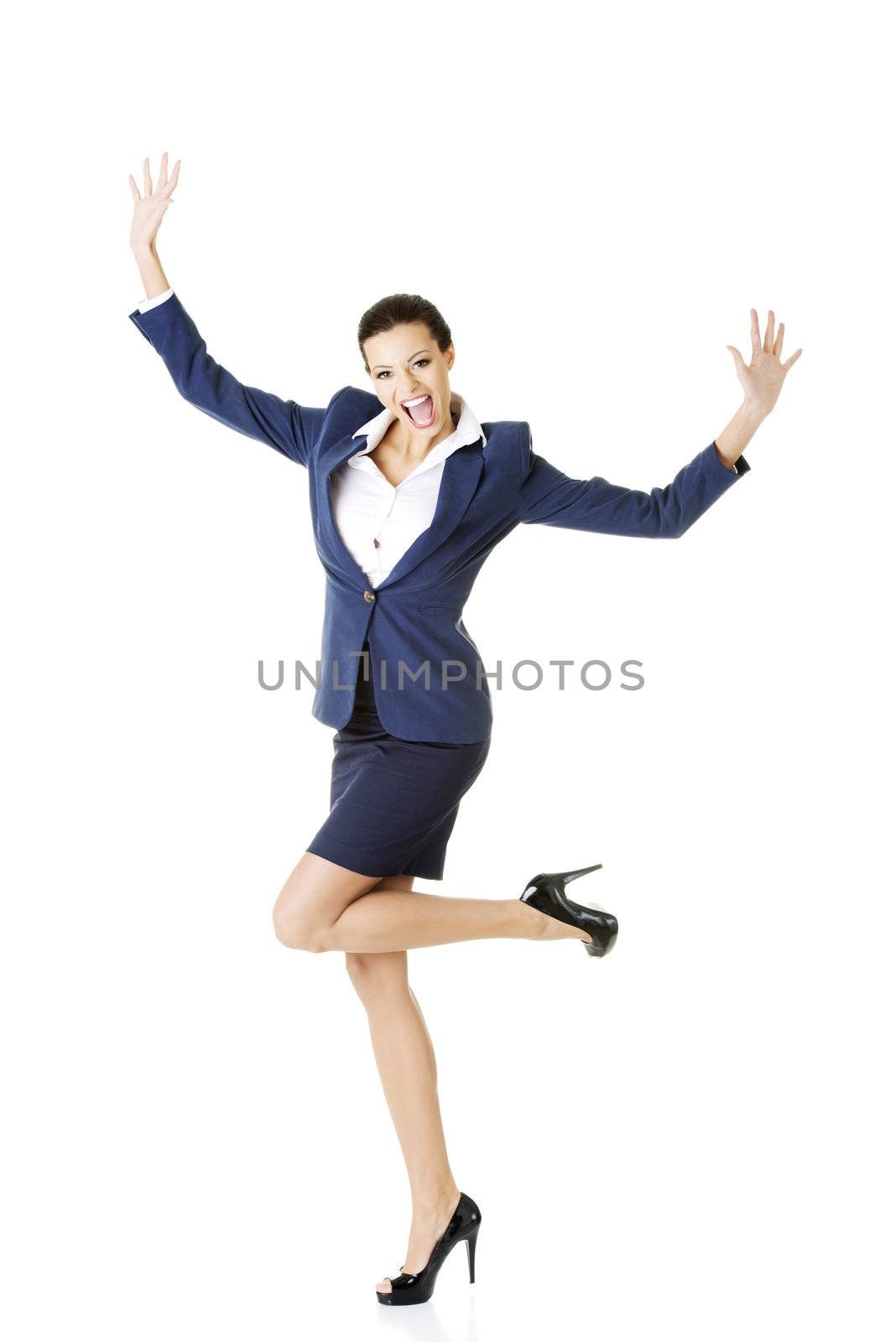 Young happy businesswoman with hands up, isolated on white