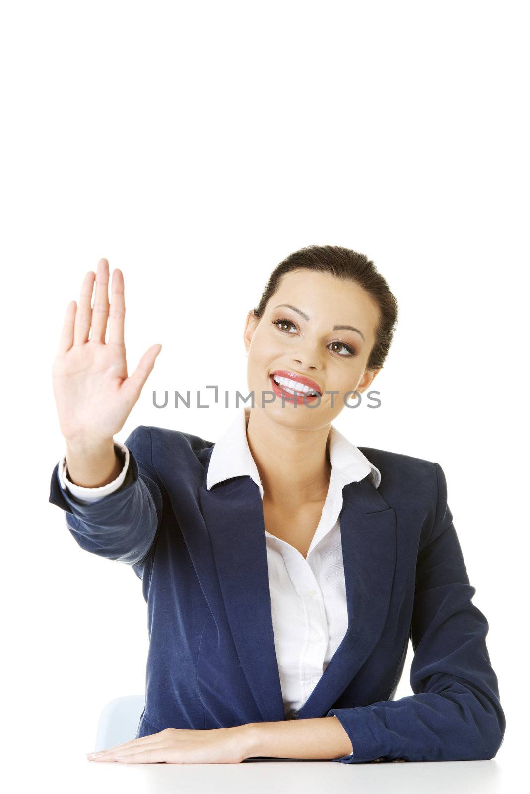 Young beautiful businesswoman making choose on abstract screen with her palm