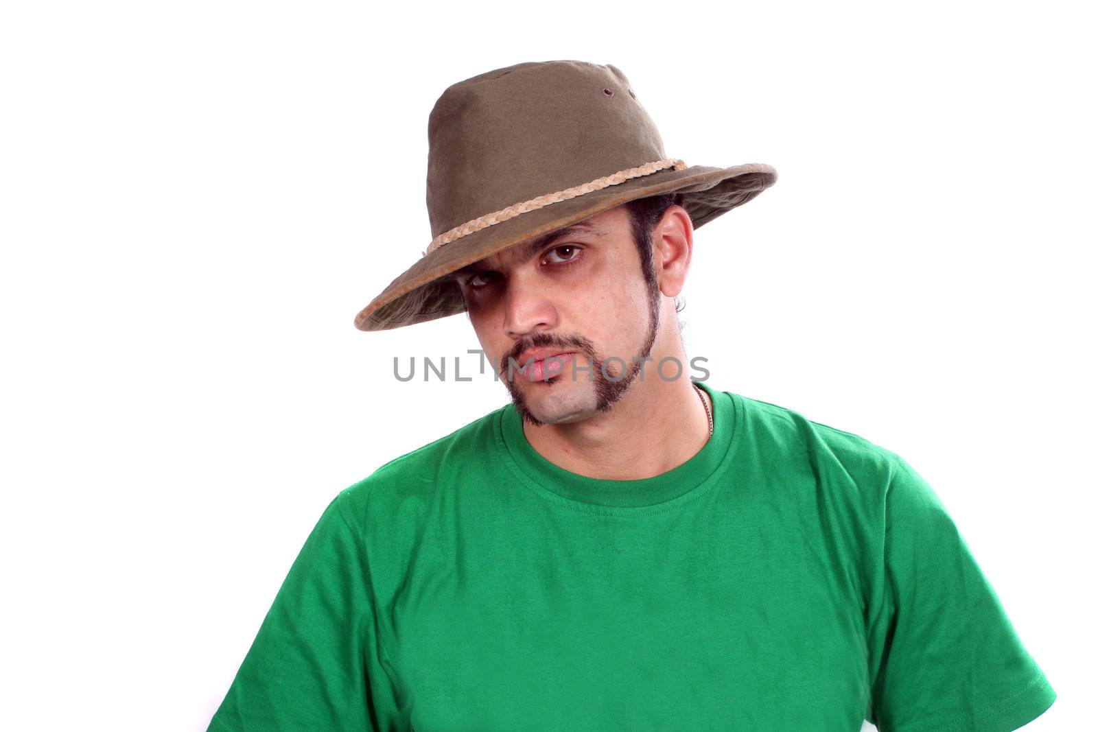 A portrait of an Indian guy wearing a brown hat, on white studio background.