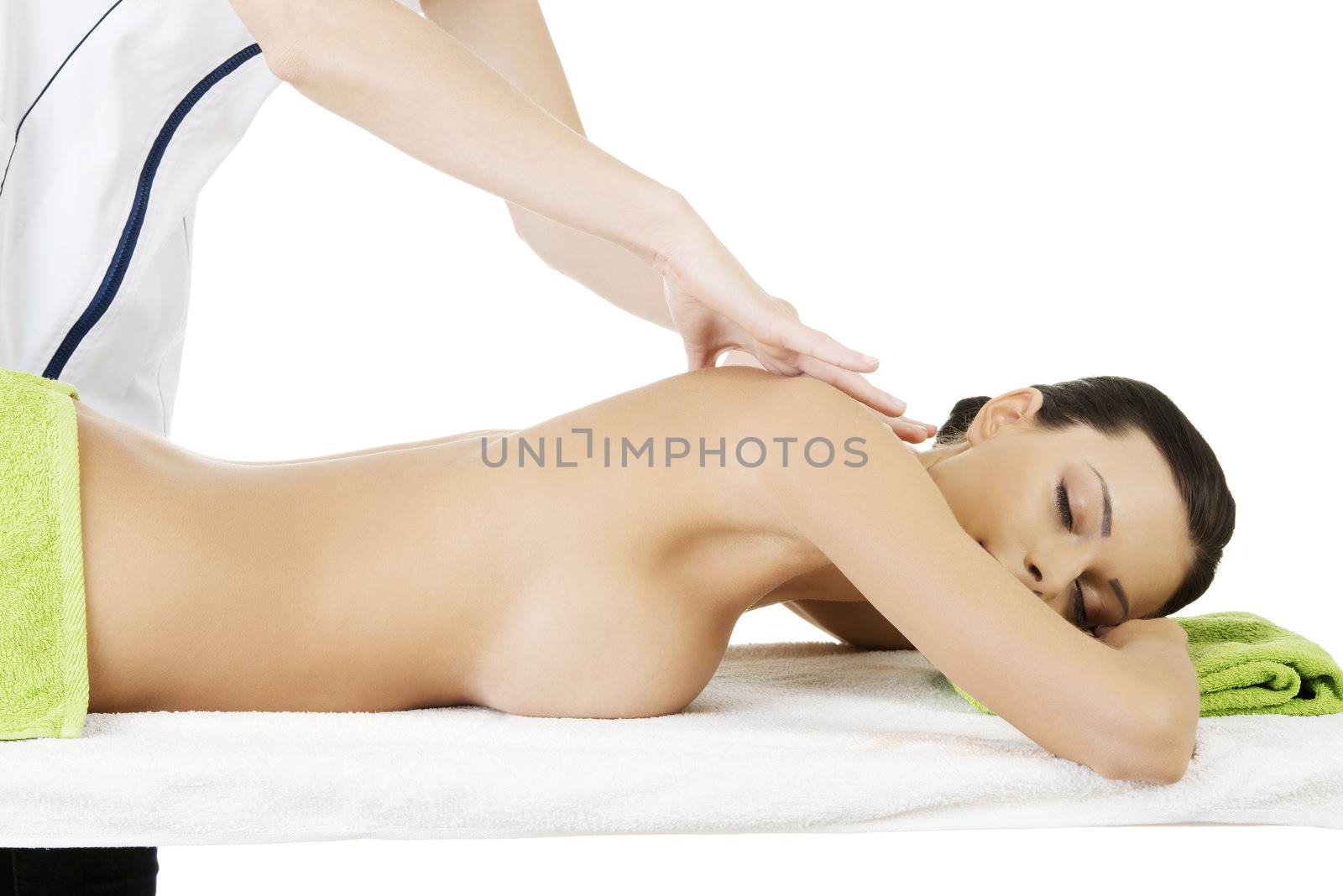 Preaty young woman relaxing heaving massage therapy in spa saloon