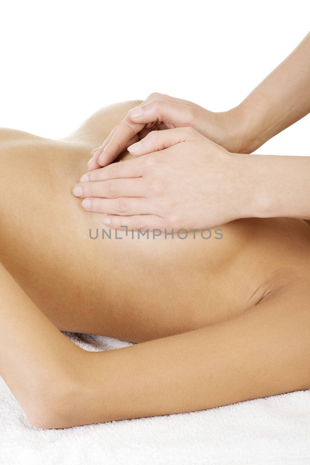 Young woman relaxing in spa. Breast massage.