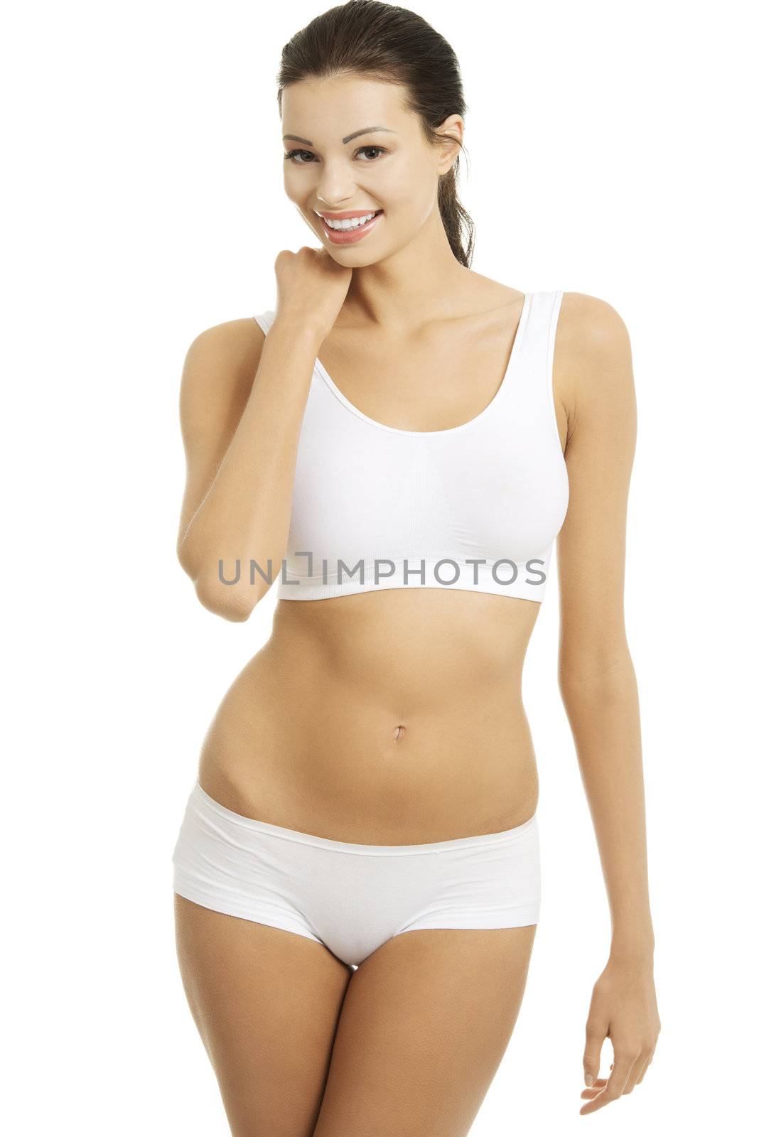Taned happy fit woman in casual underwear. Diet, healthy lifestyle and body care concept.