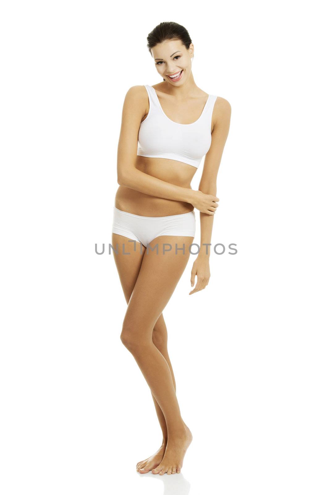 Taned happy fit woman in casual underwear. Diet, healthy lifestyle and body care concept.