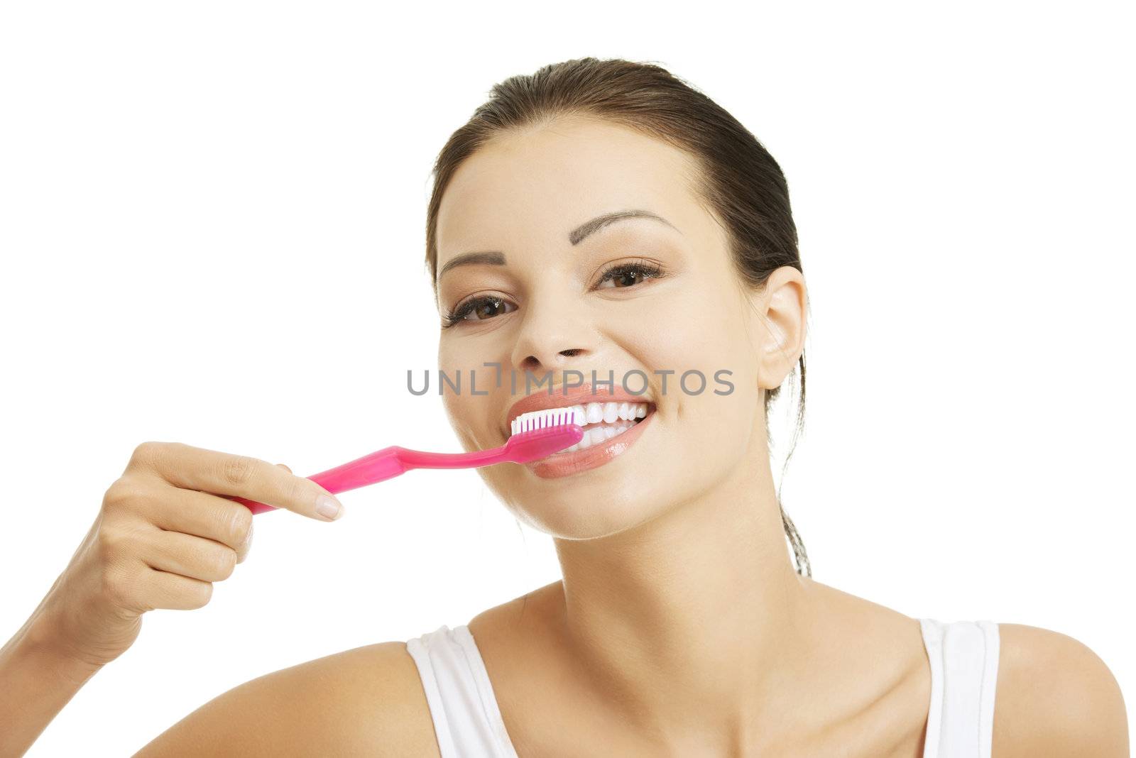 Woman with great teeth holding tooth brush by BDS