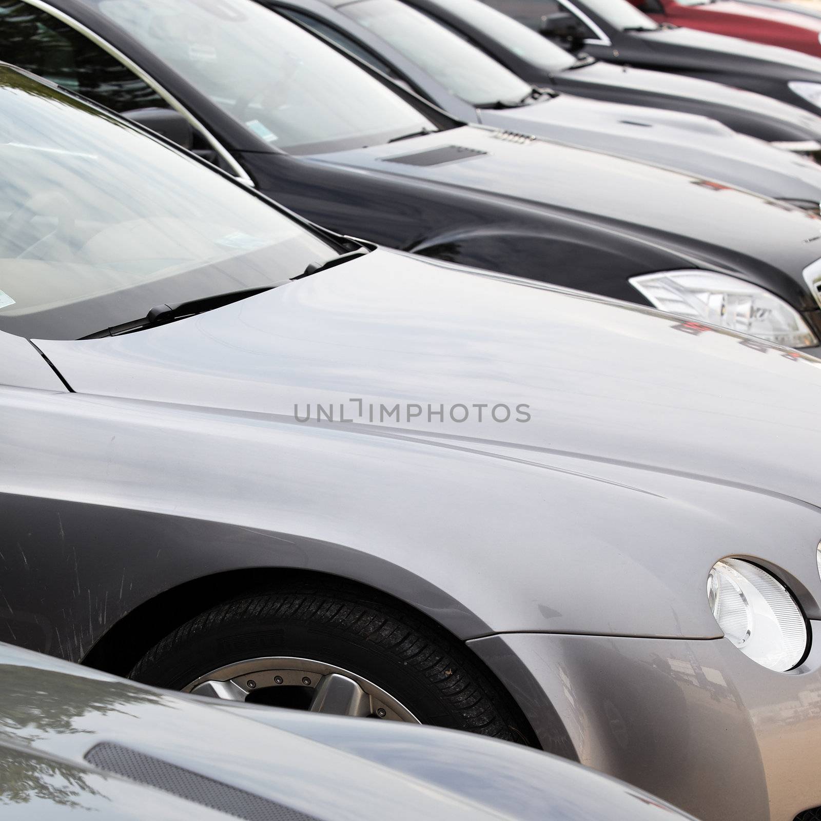 lot of sport cars in a garage for sale