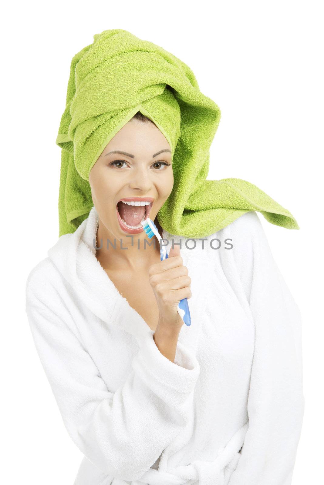 Happy attractive woman singing to tooth brush, isolated on white