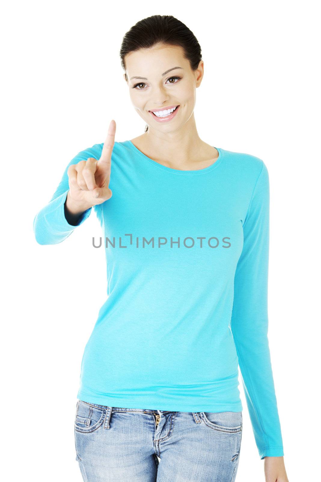 Young beautiful woman making choose on abstract screen with her finger