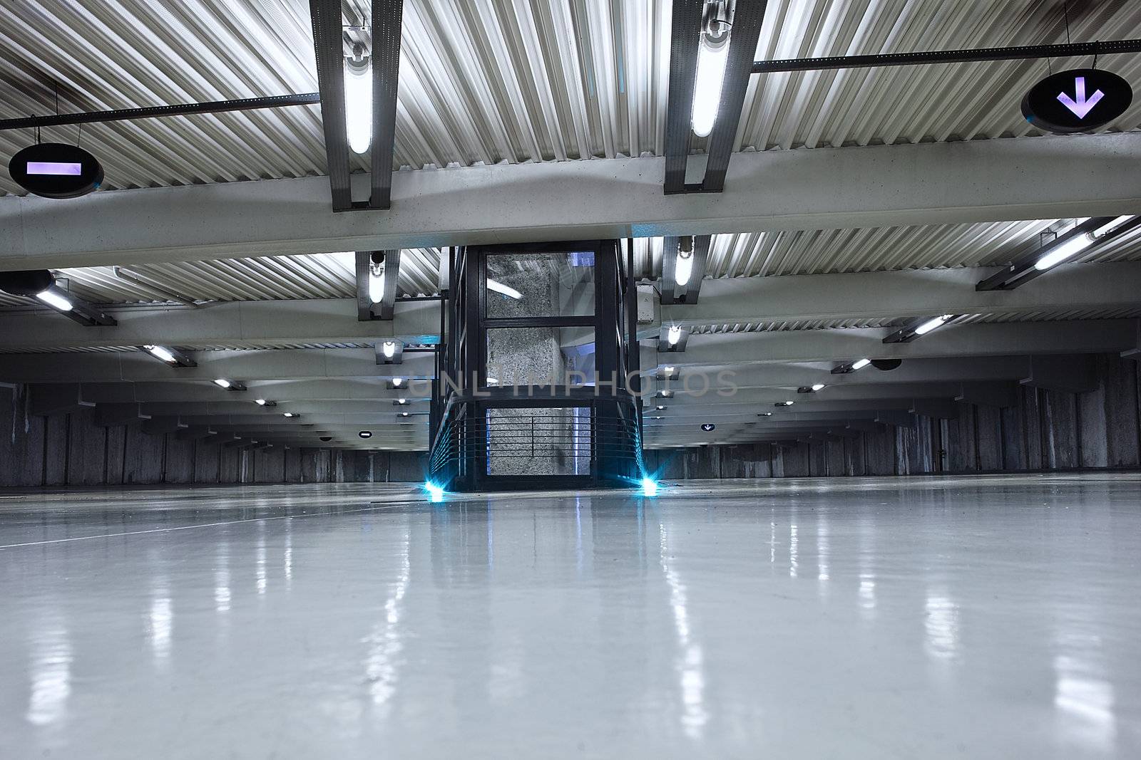 underground parking with neon light and no car