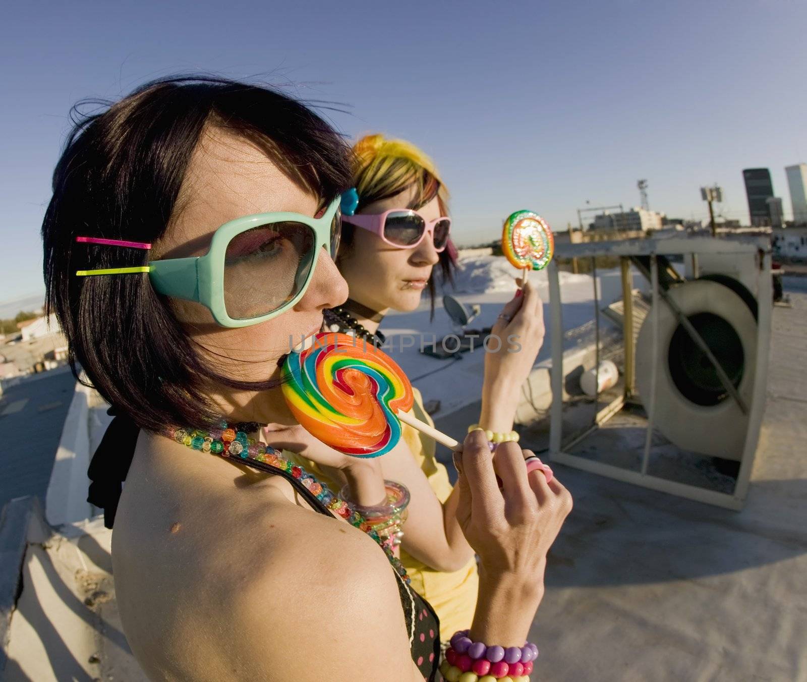 Fun girls on the roof with lollipops by Creatista