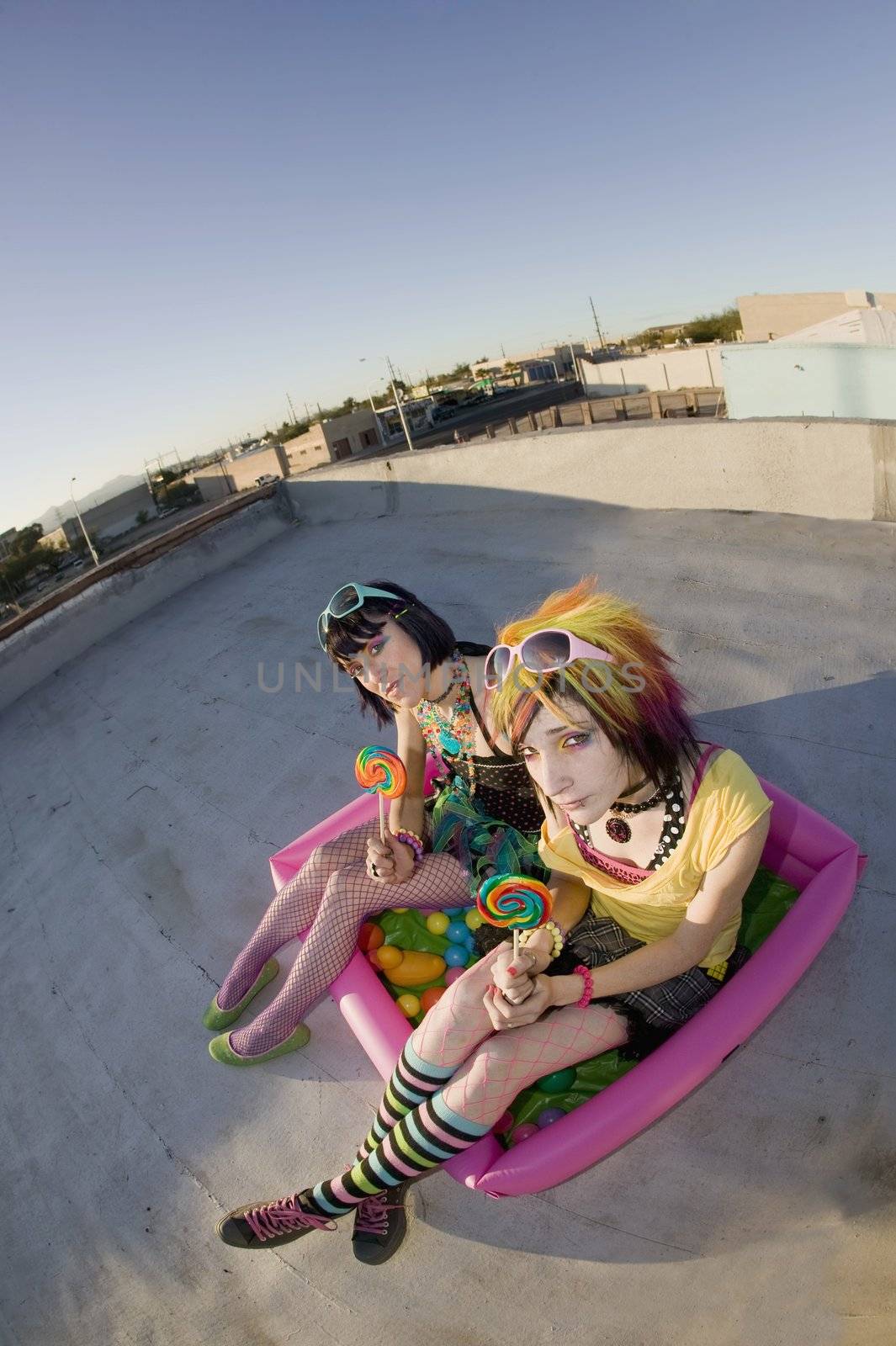 Girsl on a roof in a plastic pool by Creatista