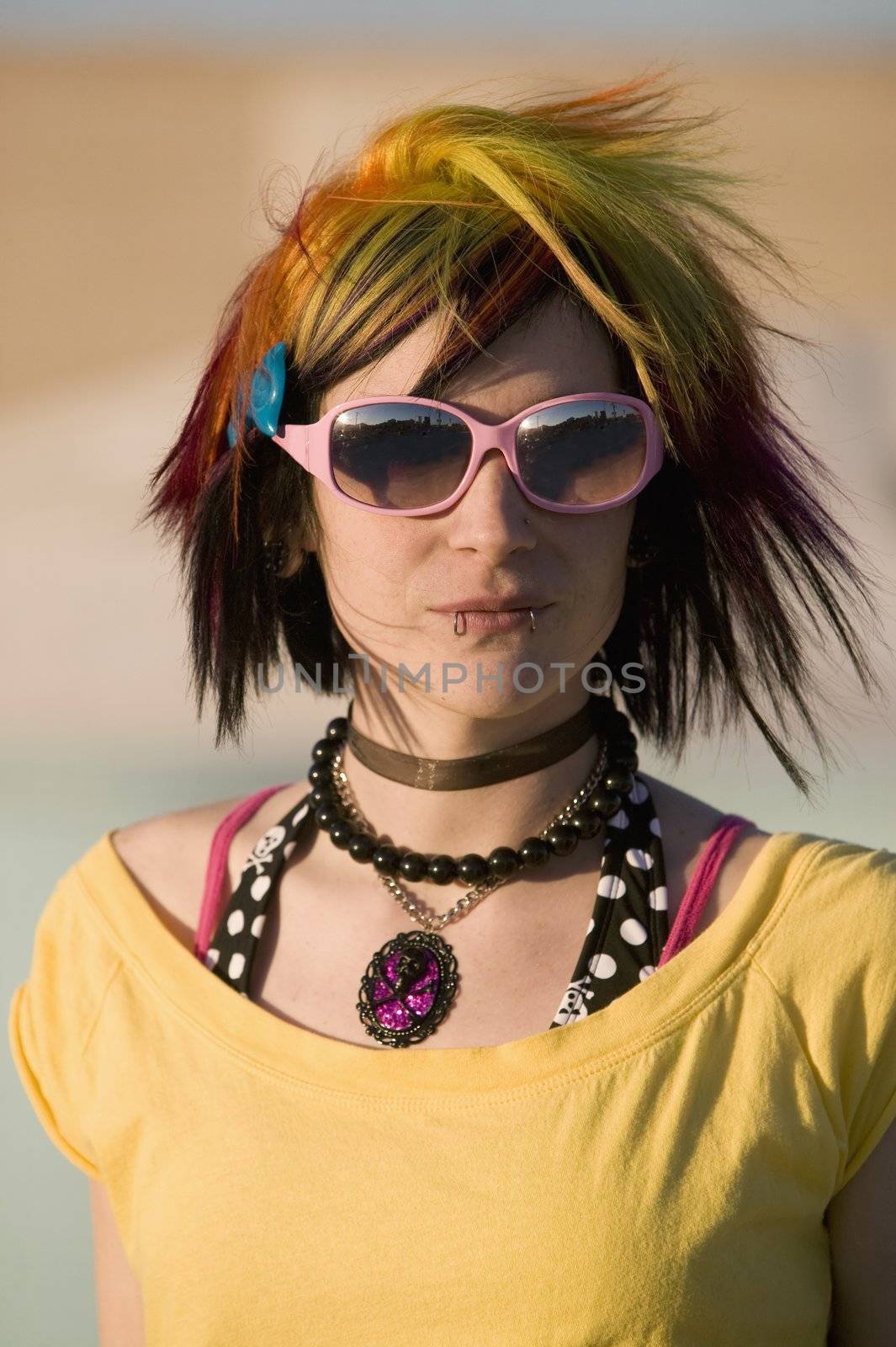 Portrait of a Punk Girl with Bright Colorful and Big Sunglasses Outdoors at Sundown