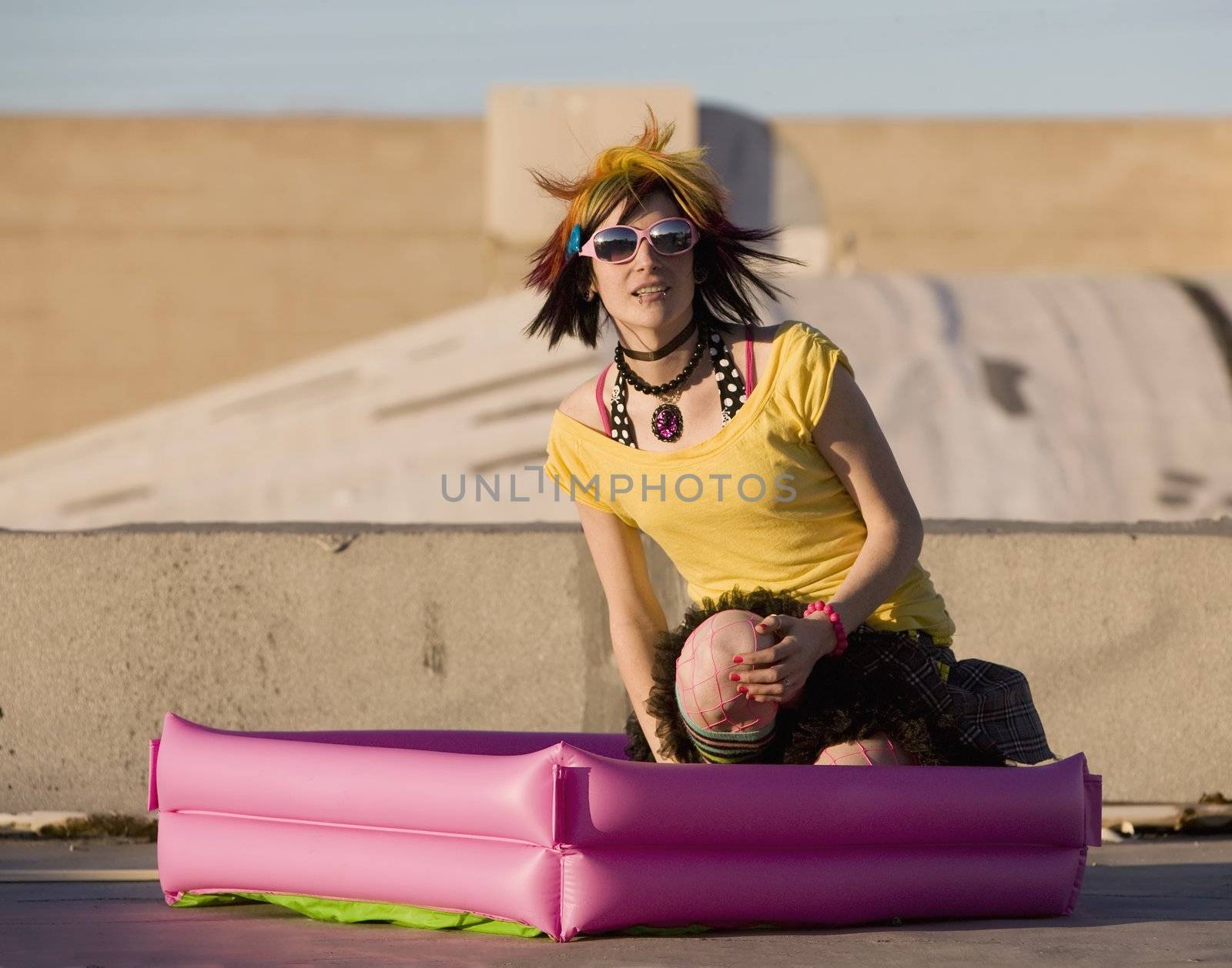 Portrait of a Punk Girl with Bright Colorful and Big Sunglasses Outdoors at Sundown