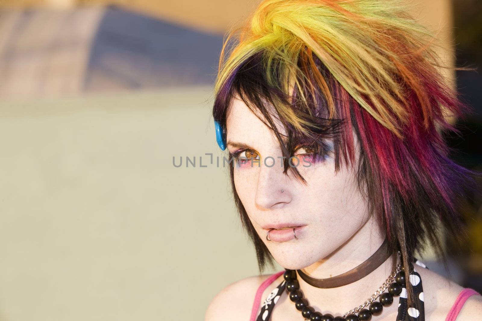 Close-up of a colorful young punk woman