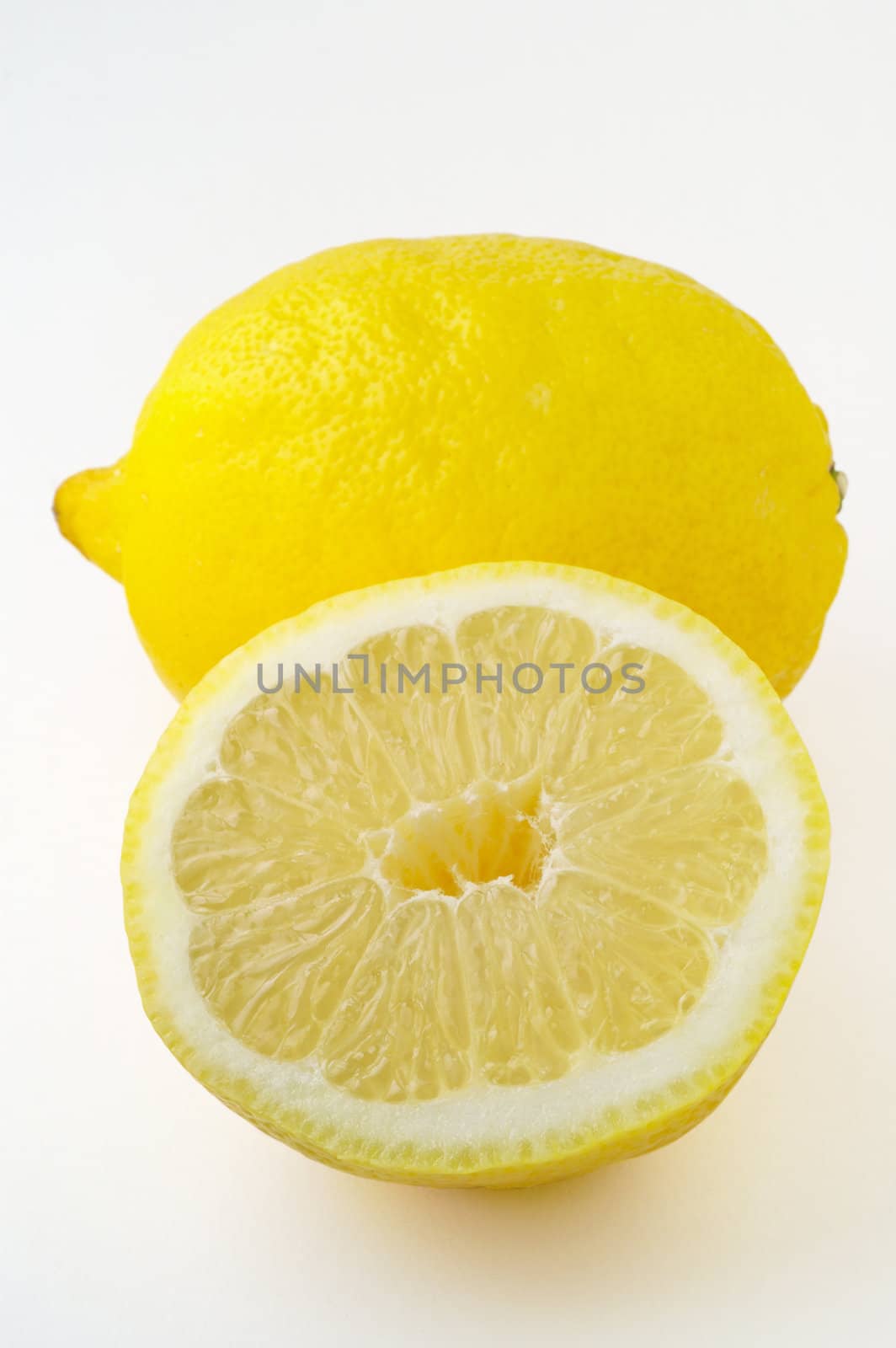 Isolated lemon and a half with clipping path by Laborer
