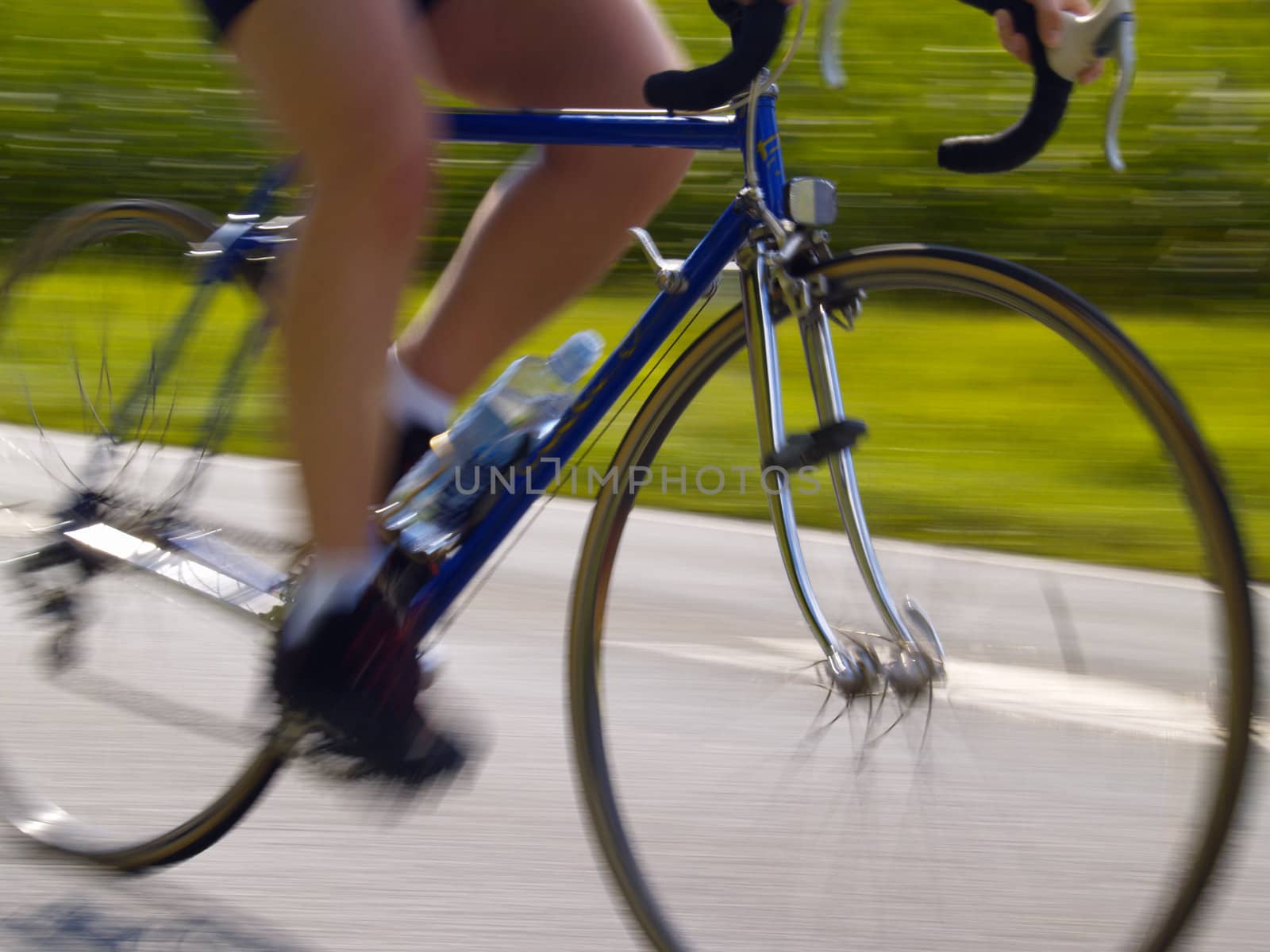 cyclist on racing bicycle, motion blur, camera movement