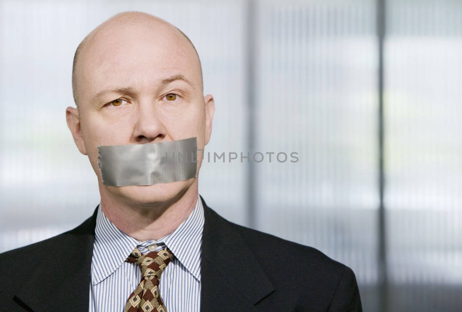 Businessman silenced with duct tape over his mouth