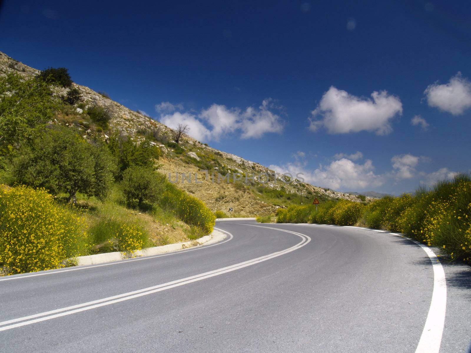 road in cretan mountains on a bright sunny day