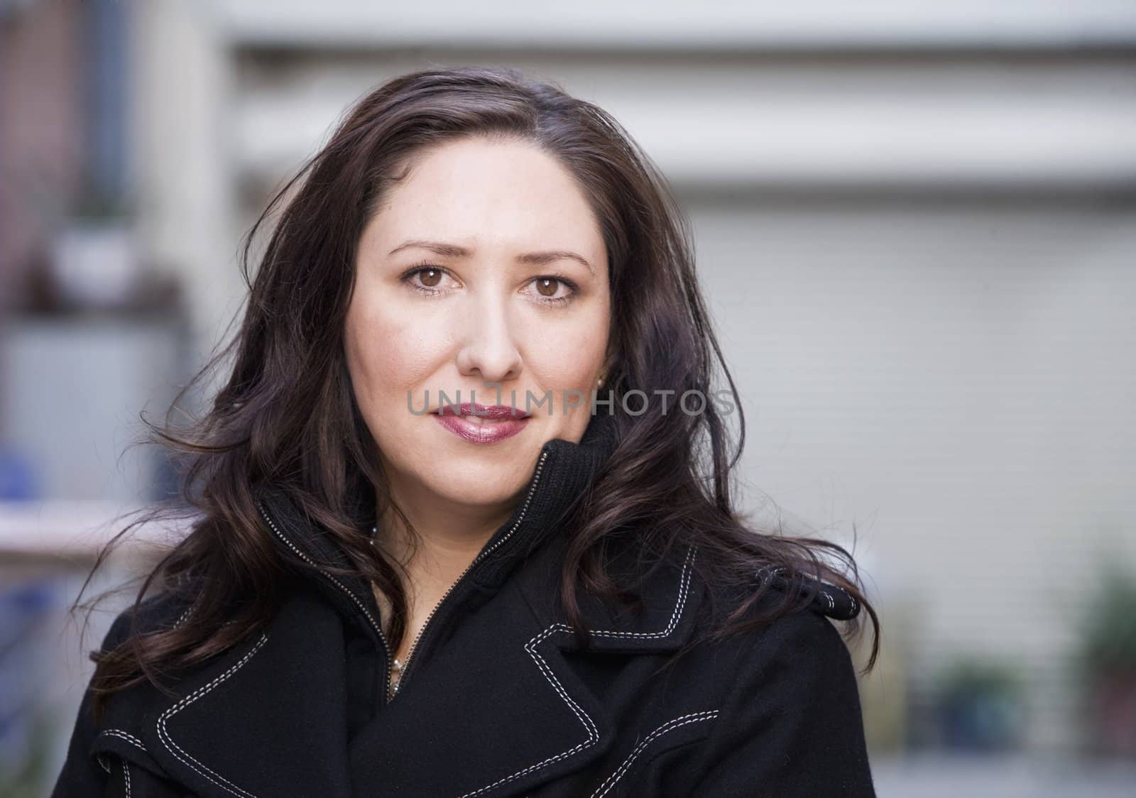 Portrait of a pretty Hispanic woman in an urban setting