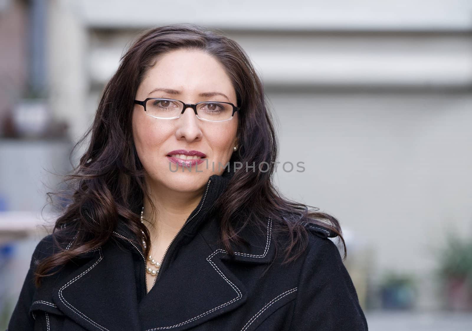 Portrait of a pretty Hispanic woman in an urban setting