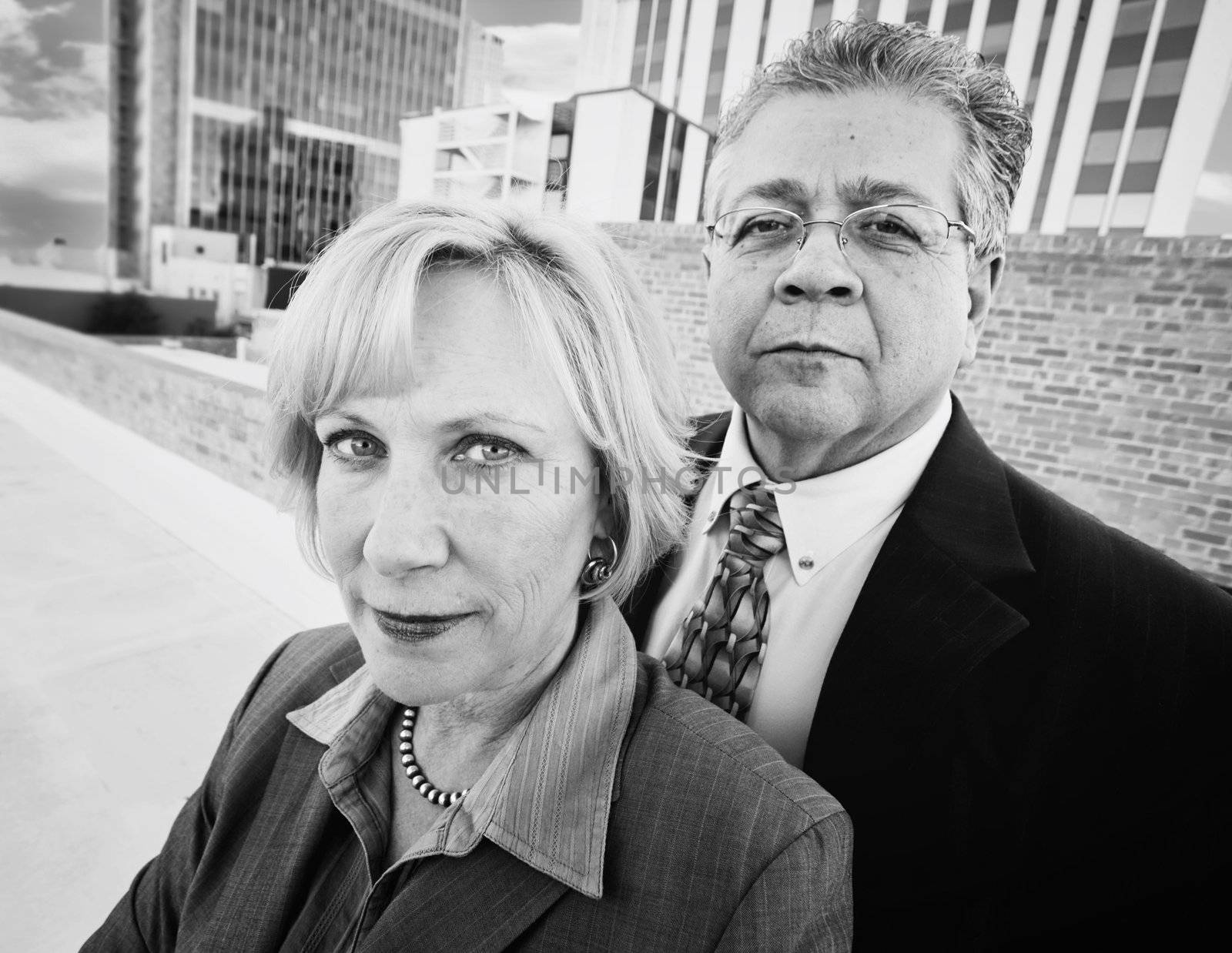 Executive man and woman on a downtown roof