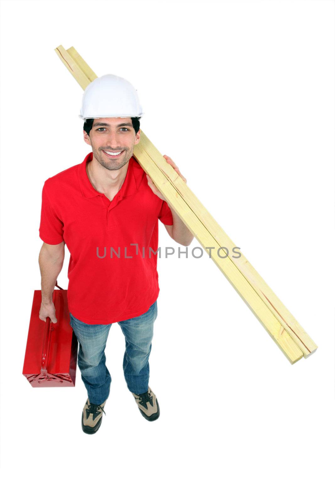 Builder with timber and a toolbox
