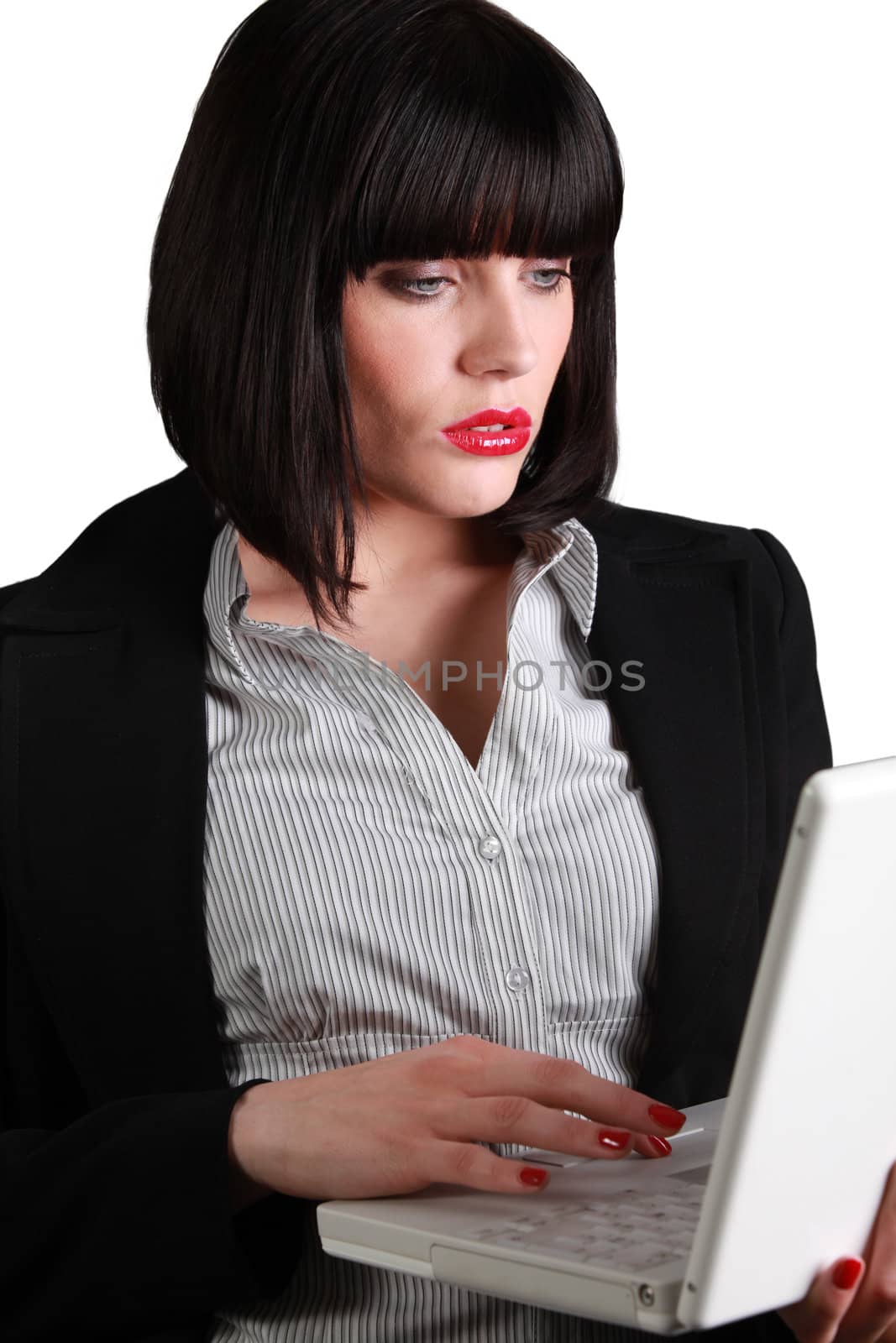Businesswoman using a laptop by phovoir