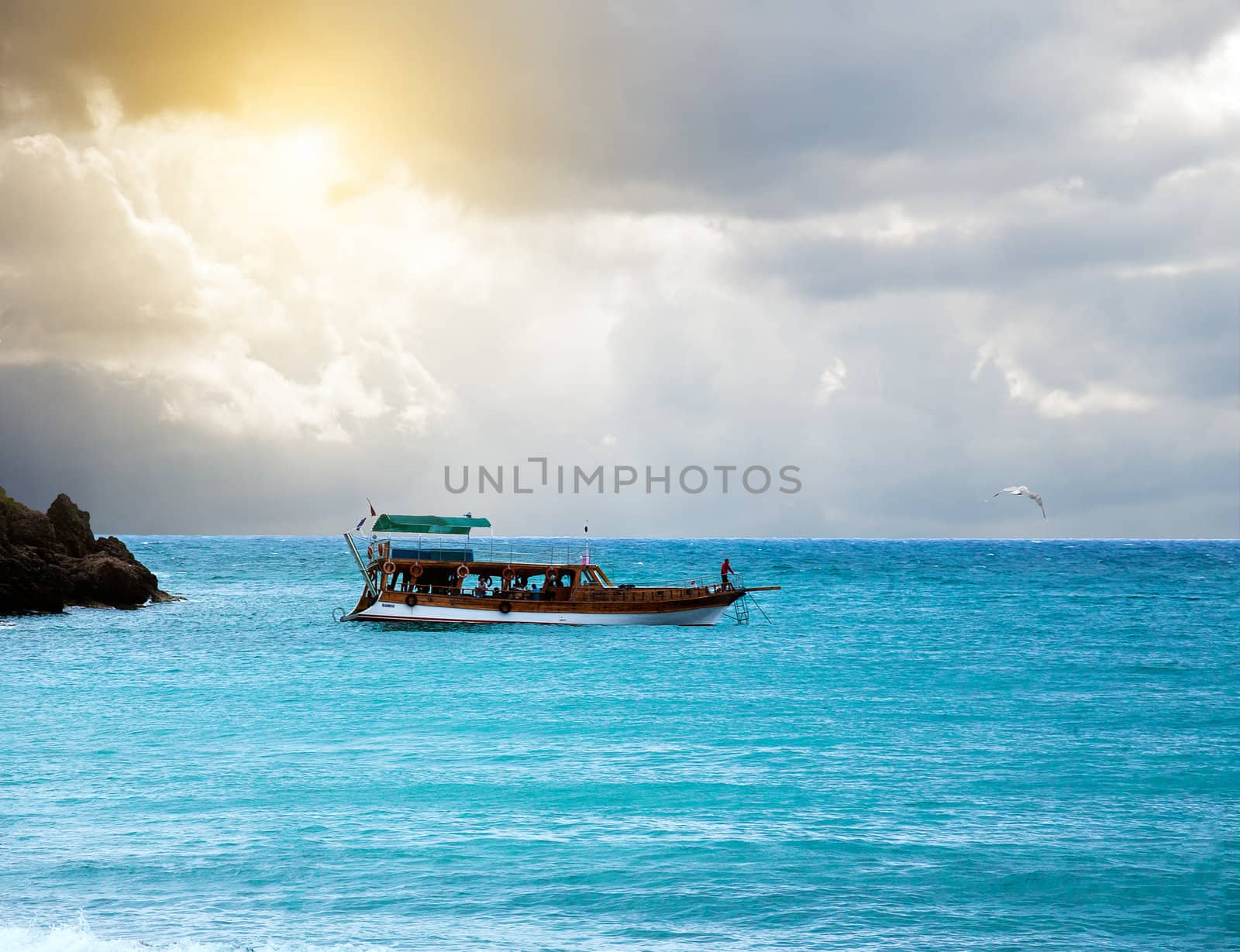 boat in the sea and stormy sky by sfinks