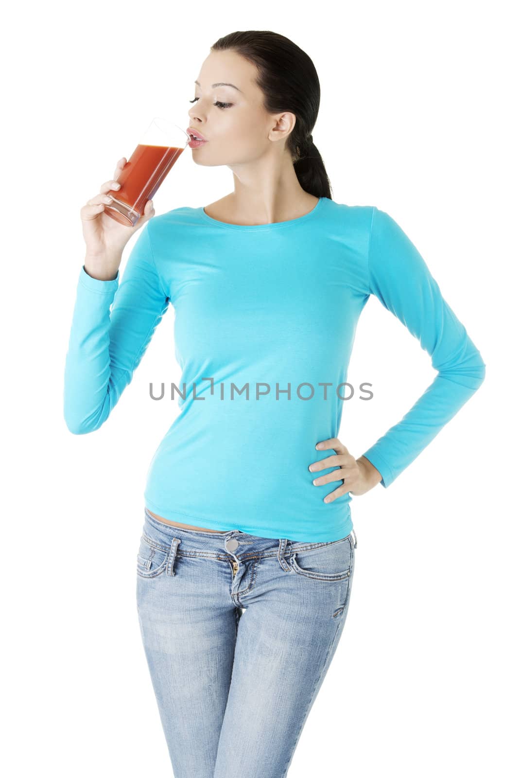 Happy smiling woman drinking tomato juice by BDS