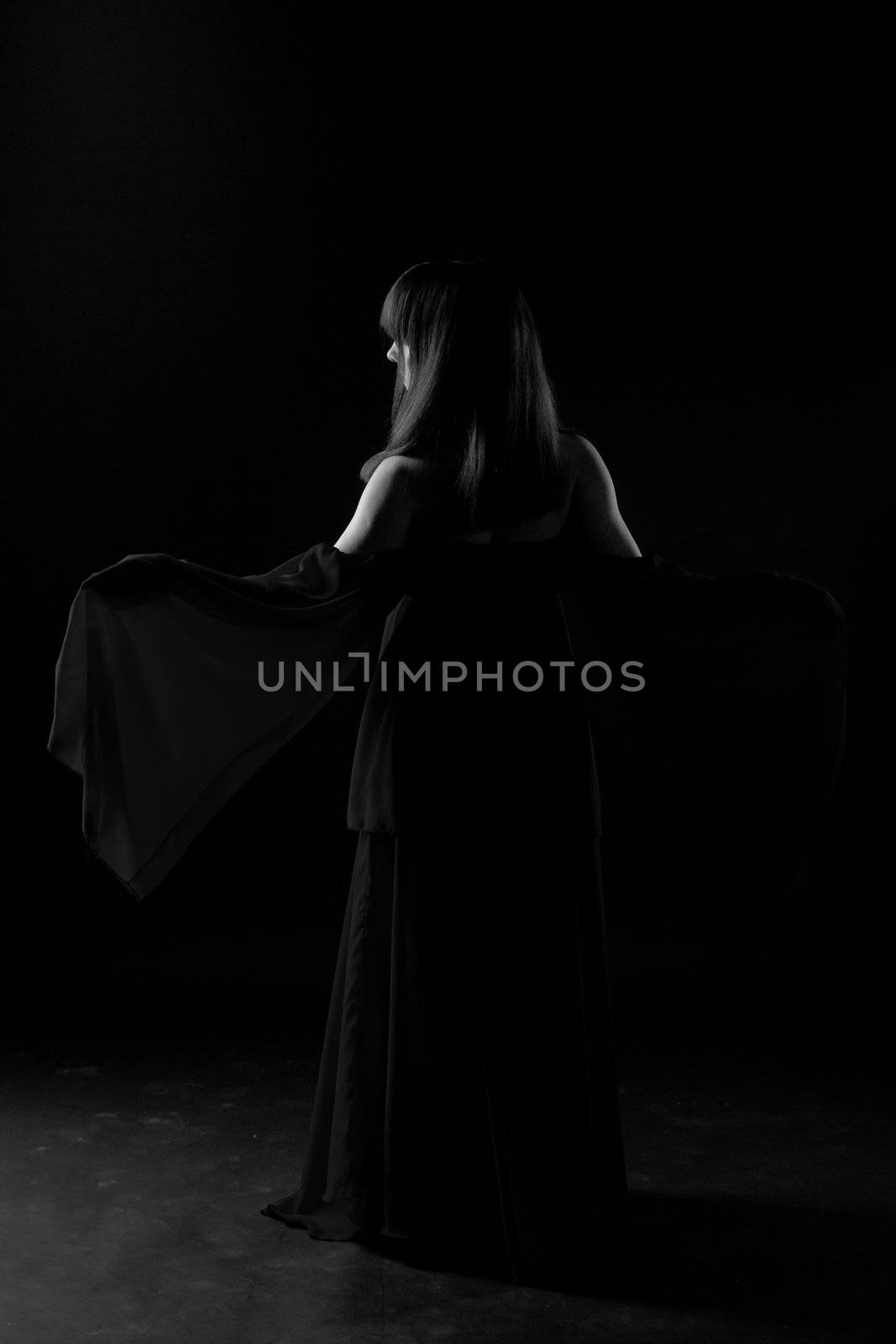 Young girl dancer in a darkness befor start
