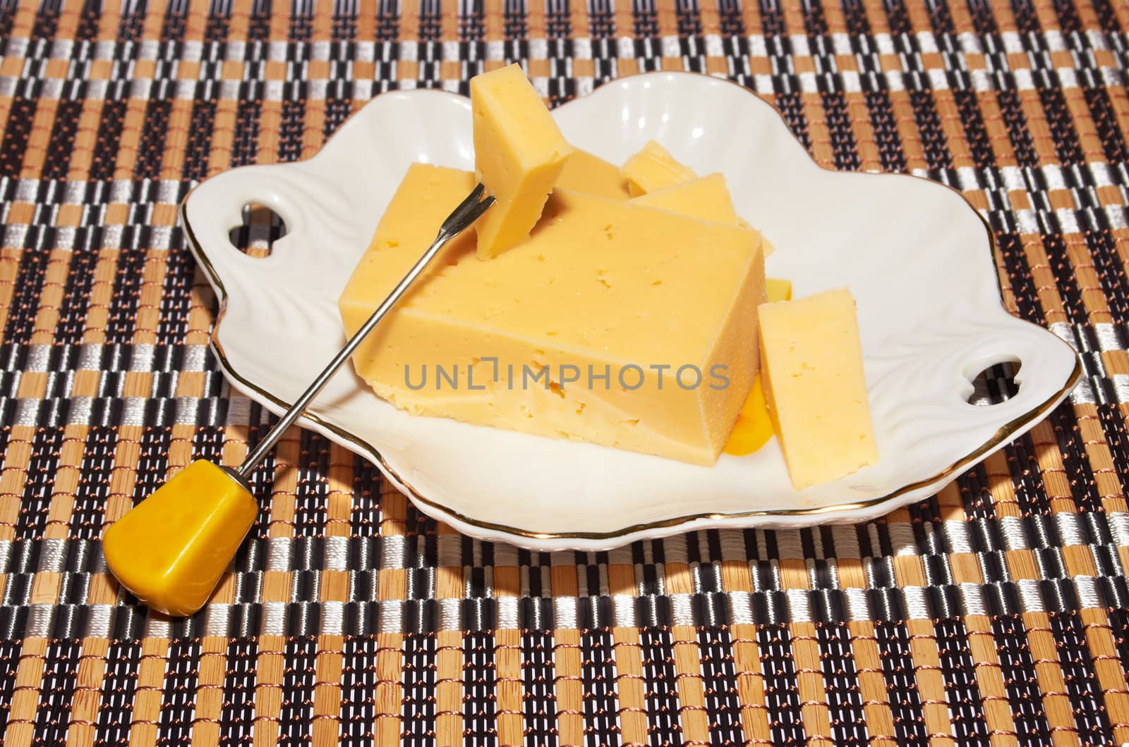 Piece of cream cheese on porcelain plate