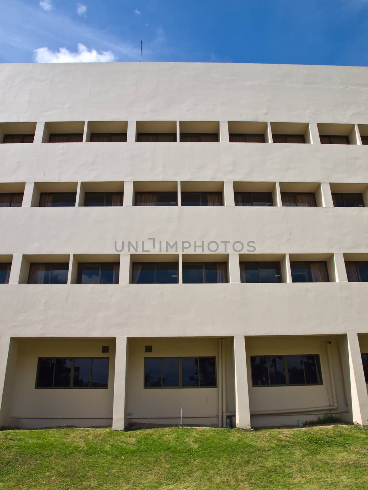 Facade windows of office building on blue sky