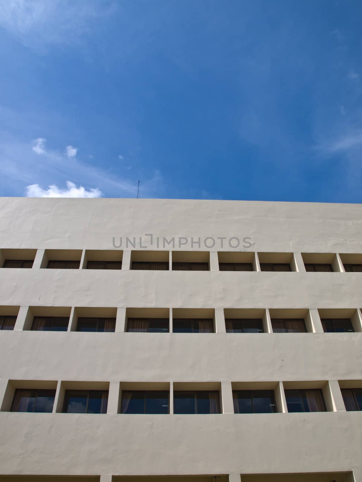 Facade windows of office building on blue sky