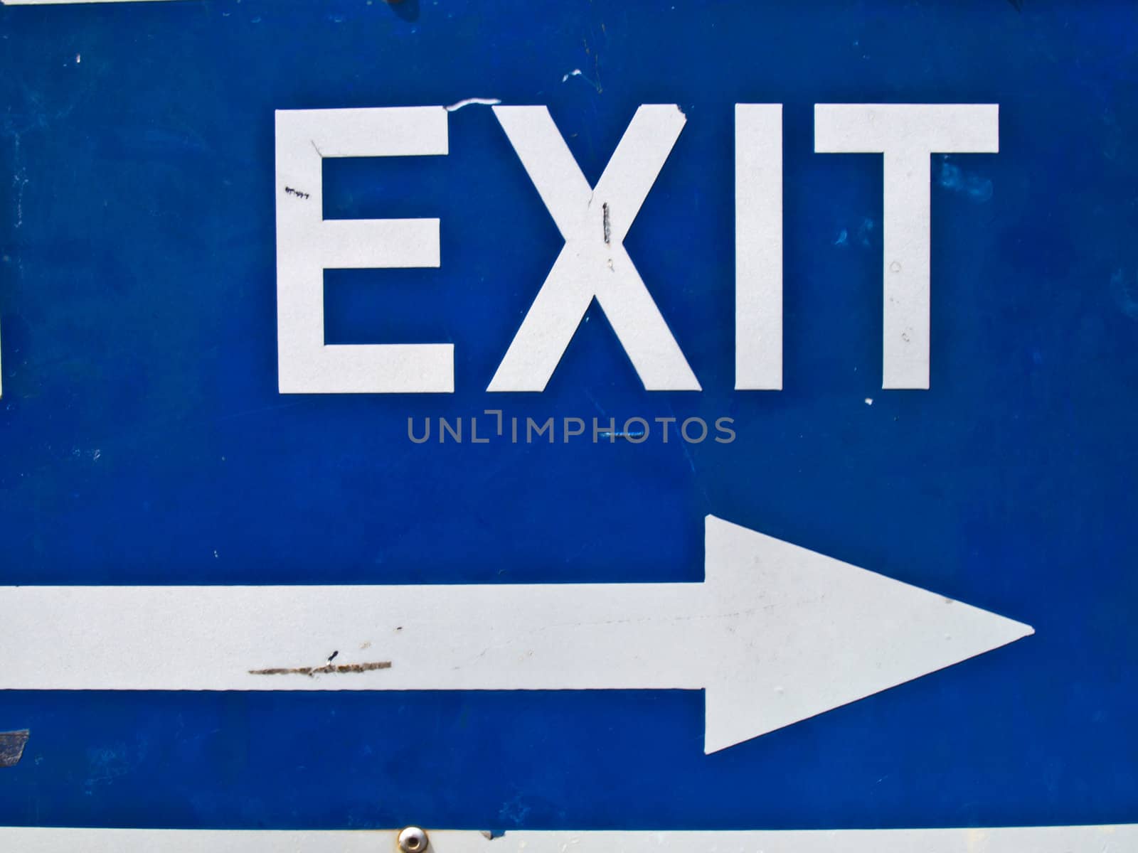 Blue exit road sign with arrow