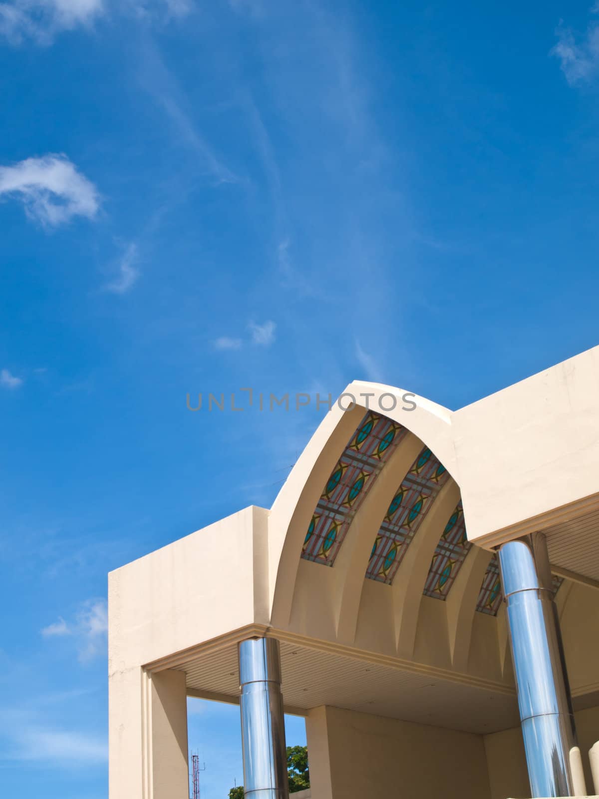 Pointed arch entrance hall of office building on blue sky