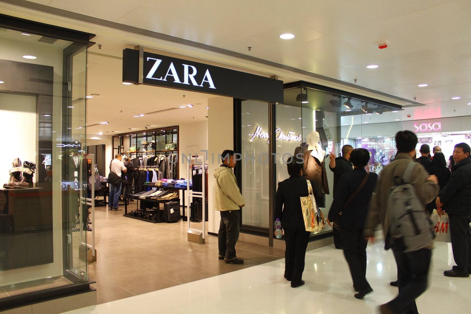 HONG KONG - DEC 22,  Zara opens a shop in Tuen Mun, Hong Kong on 22 Decemeber, 2011. There are many people shopping there.  