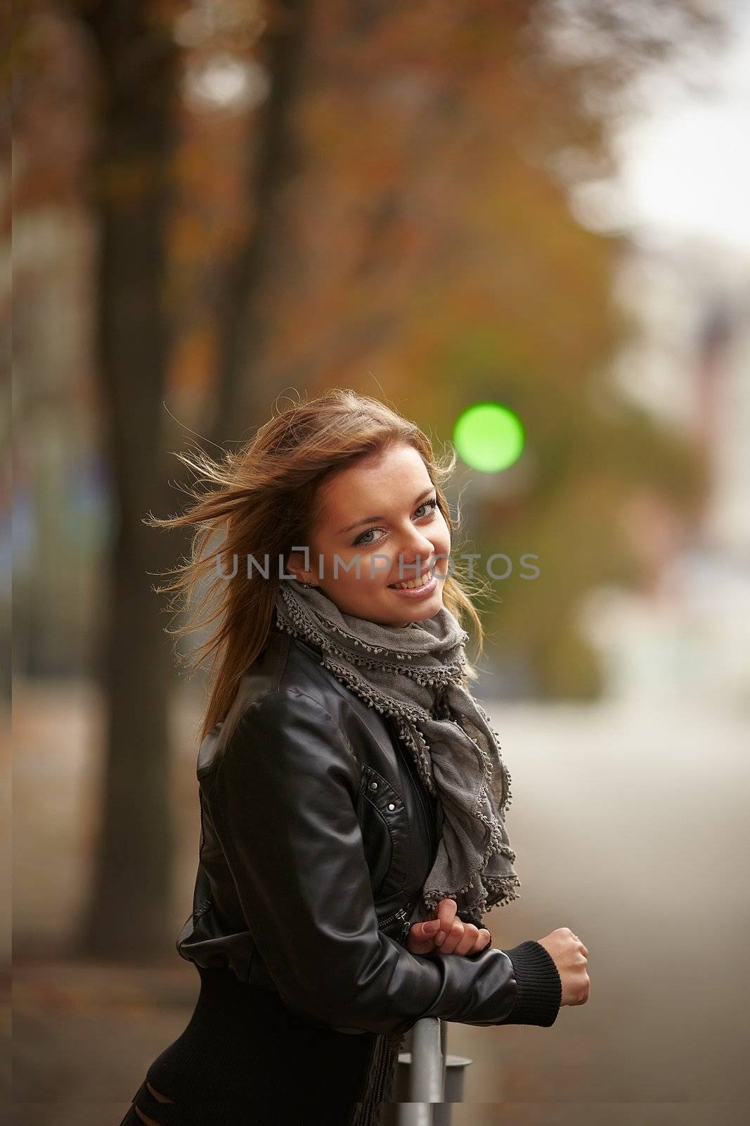 Beautiful girl in autumn city by Videoroot