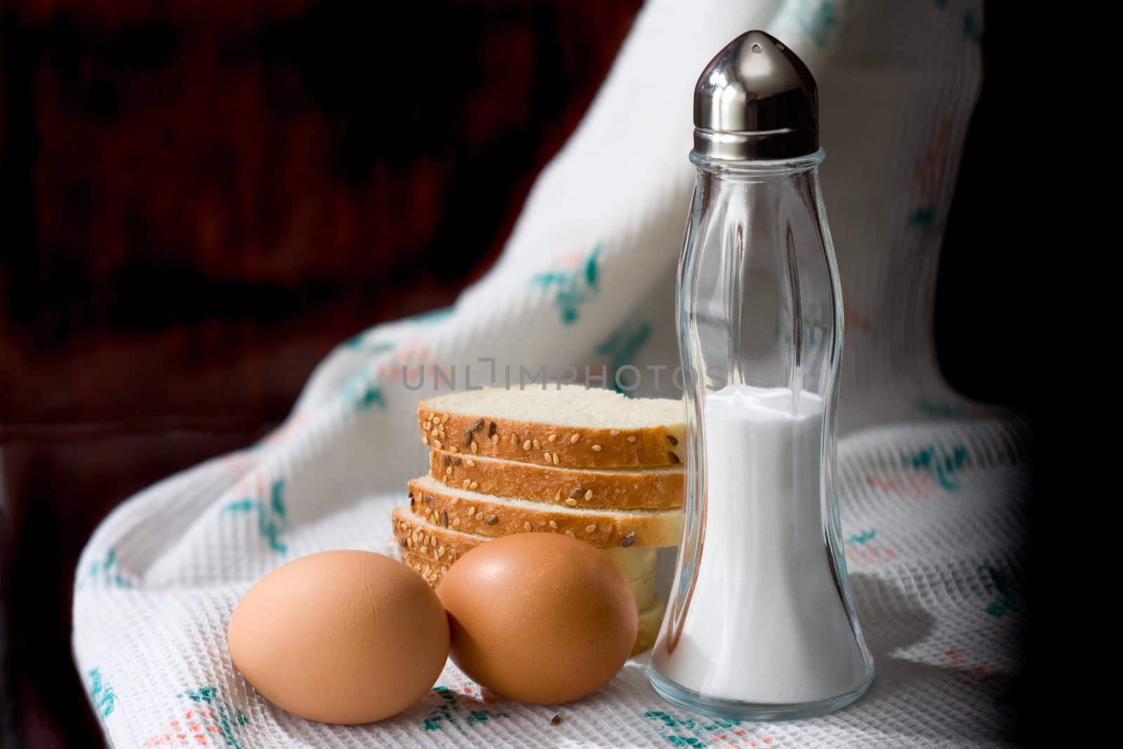 Chicken eggs, bread and salt for a breakfast