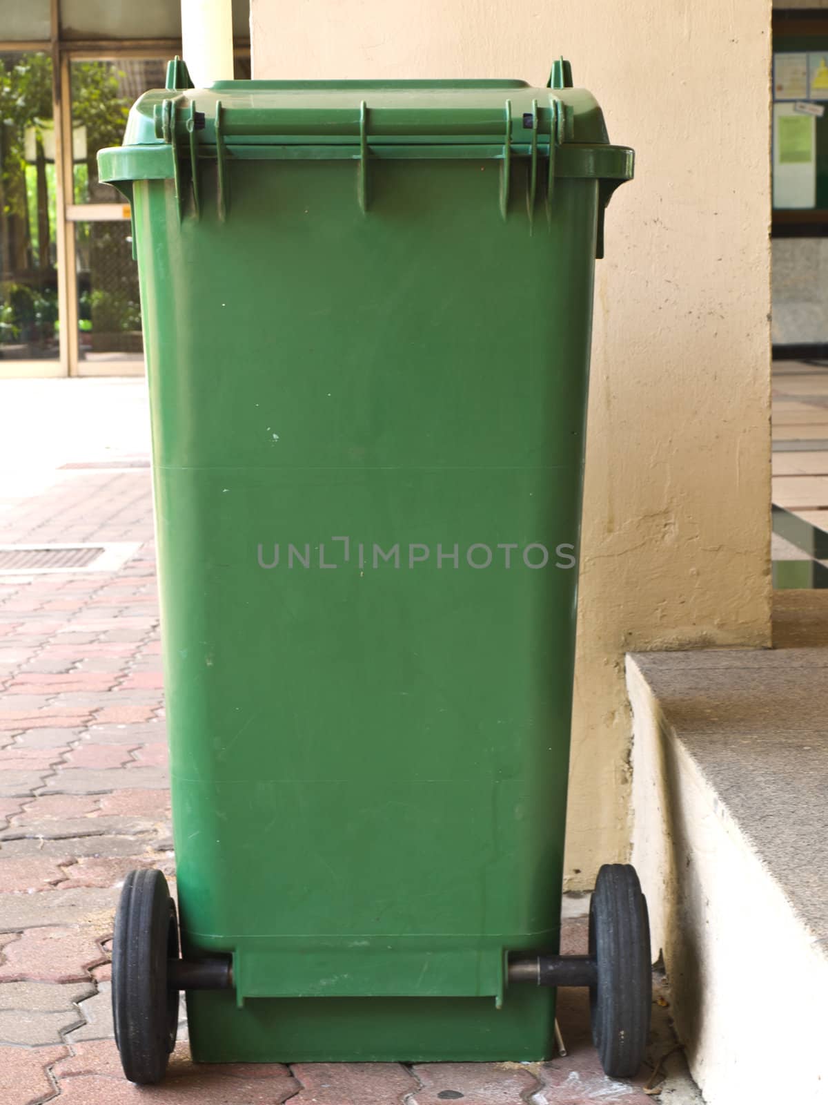 Green plastic bin