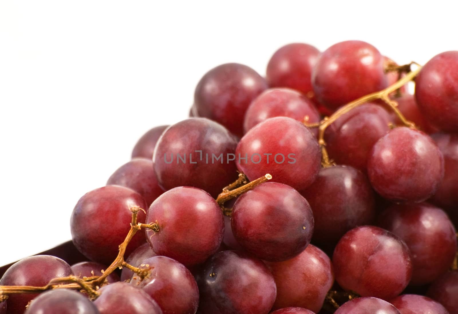 Close up of a bunch of red grapes with a shallow depth of field