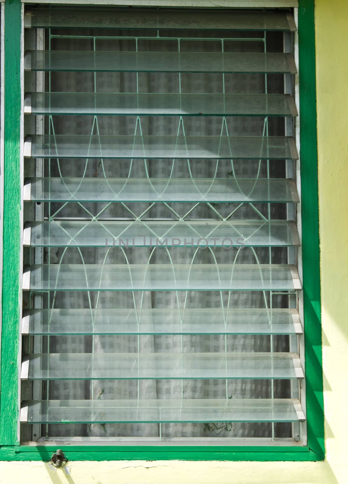 An opened glass lourve window
