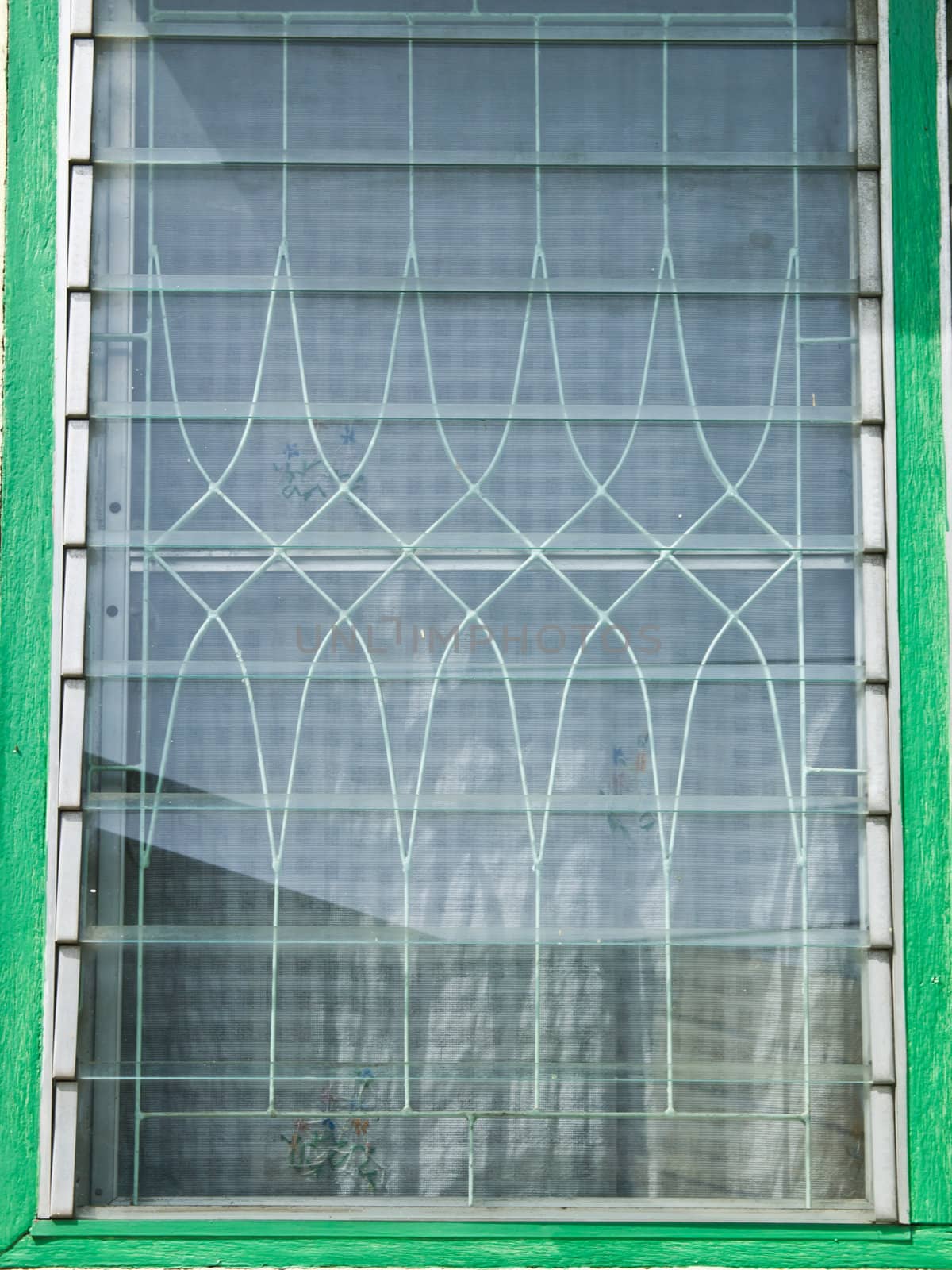 A closed glass lourve window